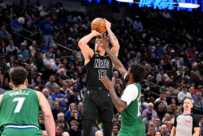 Jan 12, 2026; Dallas, Texas, USA; Brooklyn Nets forward Michael Porter Jr. (17) shoots the ball over Dallas Mavericks forward Naji Marshall (13) during the second half at the American Airlines Center.