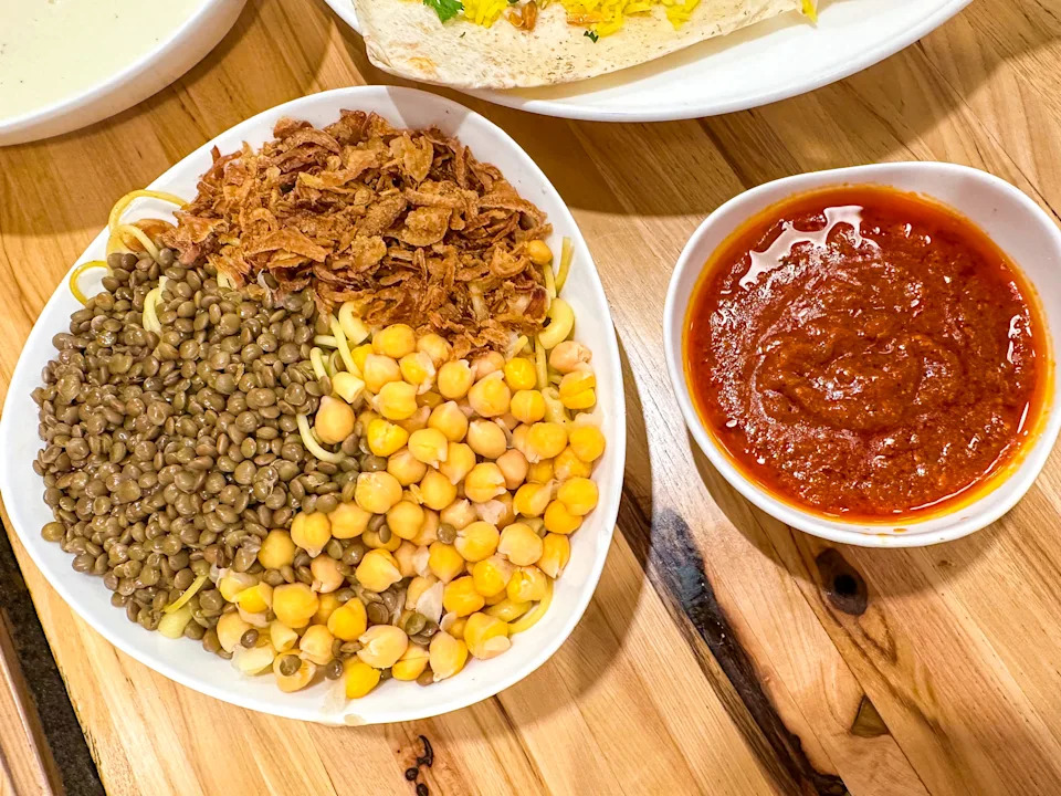 Bowl of lentils, chickpeas, and garlic (koshary, the national dish of Egypt)