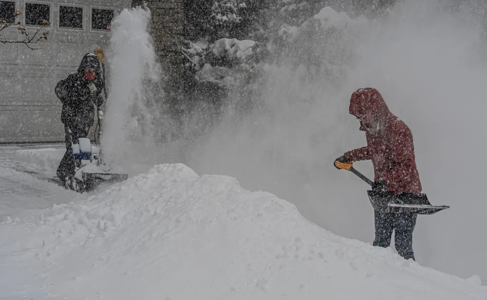 Eileen Walter of Tarrytown, N.Y. gets the brunt of the snow being blown by her son William, 10, as they clear the snow from their driveway at the height of the winter storm Jan. 25, 2026. The storm was predicted to drop up to a foot of snow on the lower Hudson Valley.