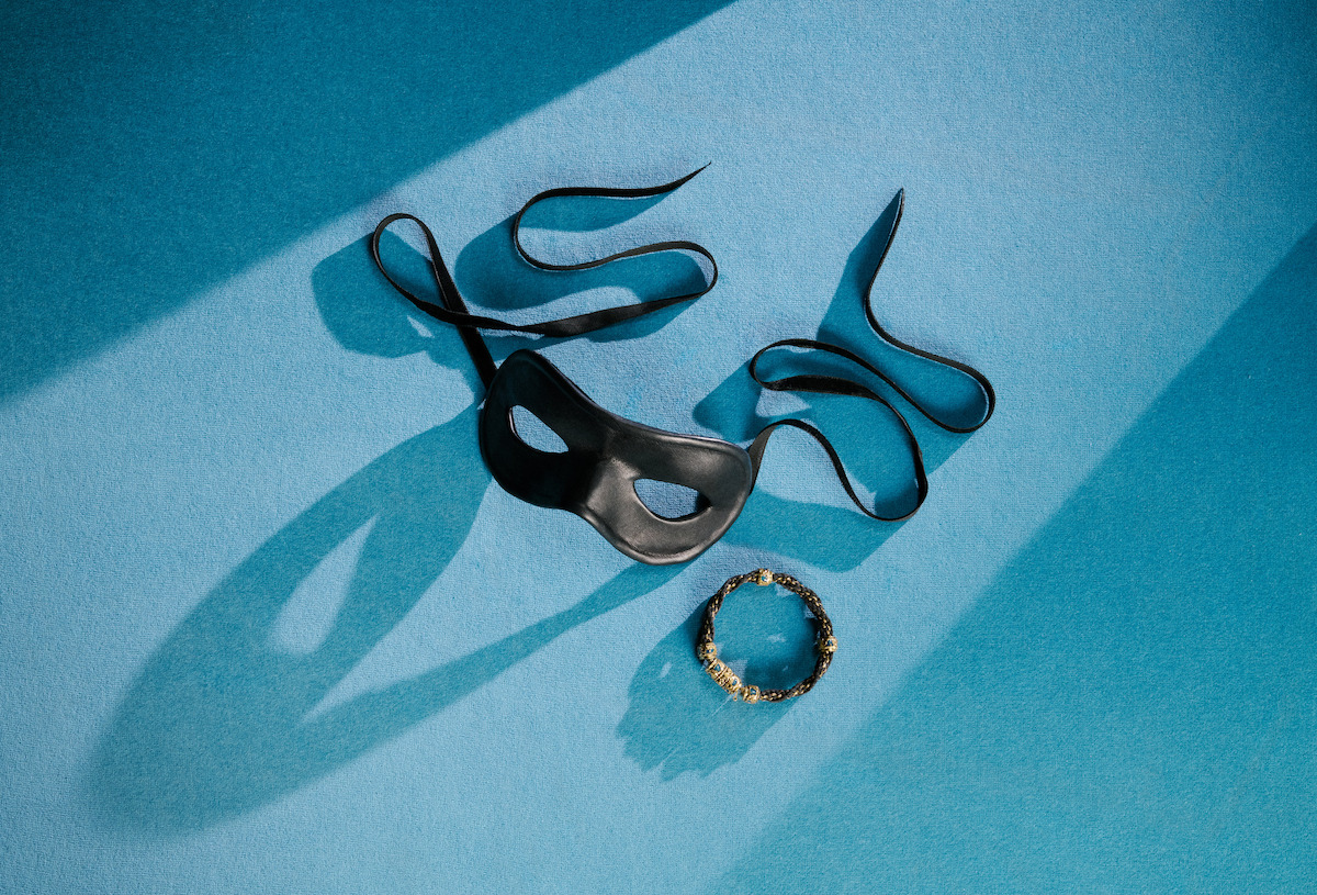 Benedict’s masquerade mask on light blue background