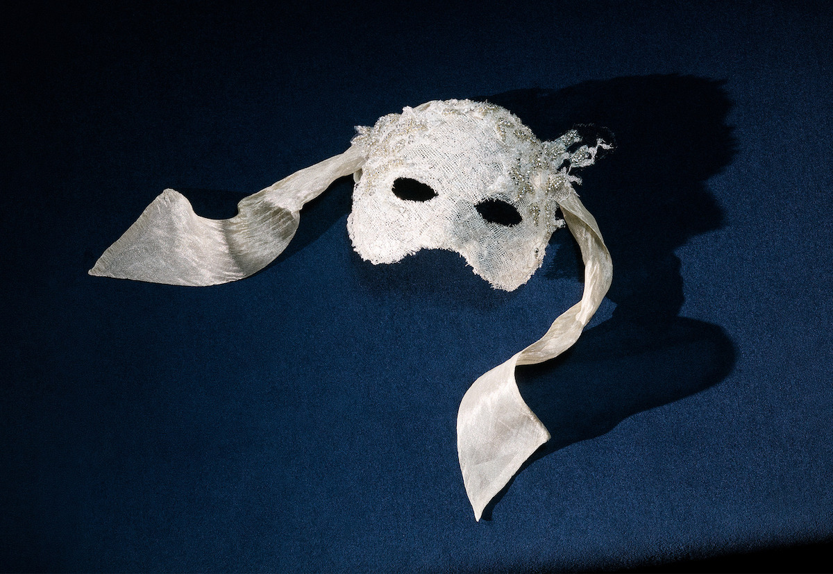 Sophie’s masquerade mask on dark blue background