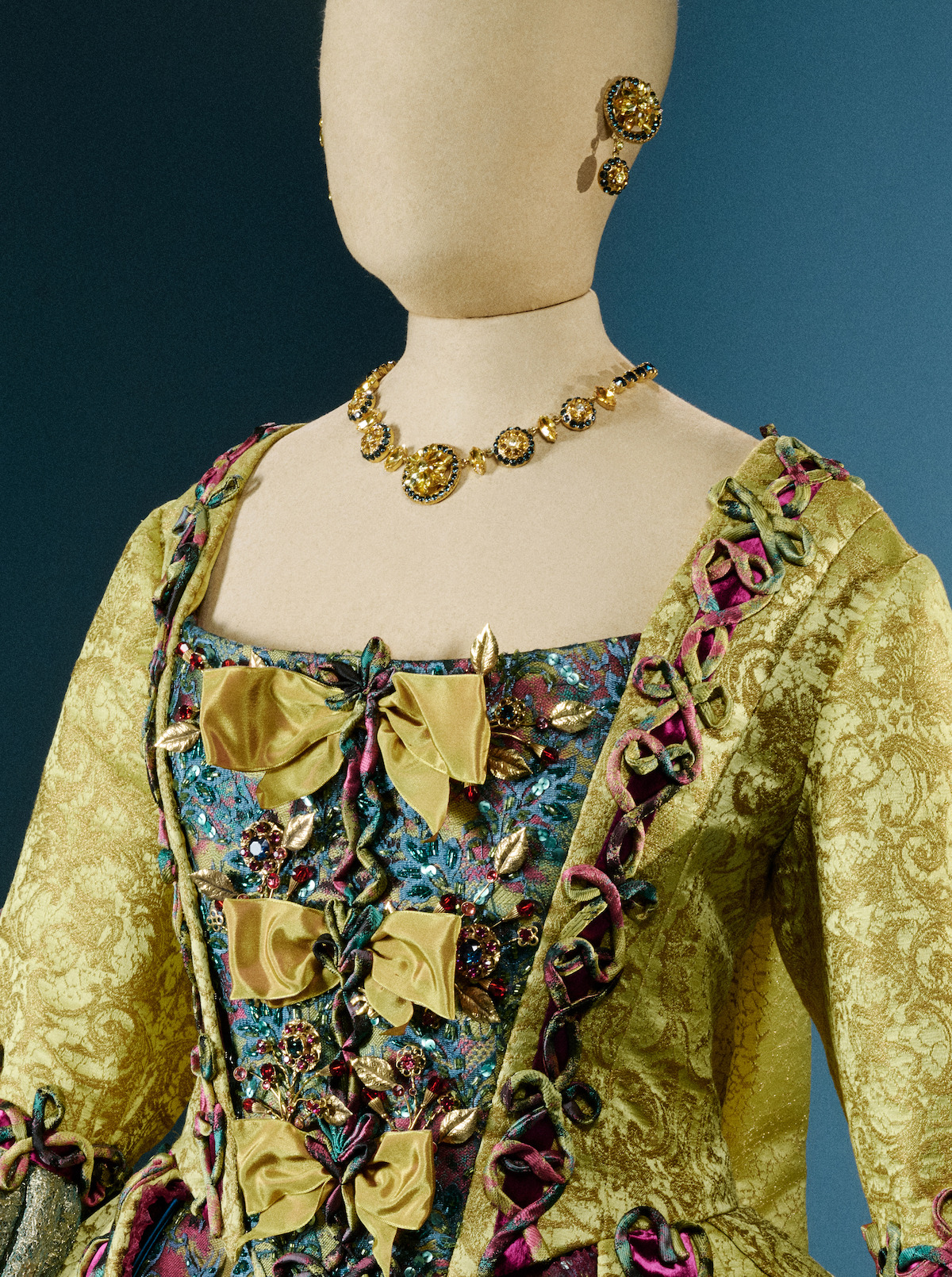 Queen Charlotte’s yellow dress with bows, necklace and earrings