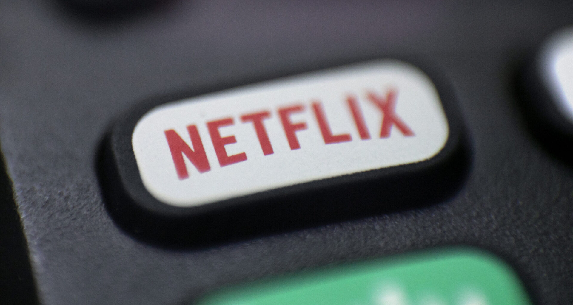 This Aug. 13, 2020, photo shows a logo for Netflix on a remote control. AP Photo/Jenny Kane