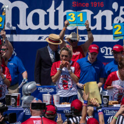 Competitive eaters eat hot dogs during the 2025 Nathan's Famous Fourth of July hot dog eating contest in Coney Island, Thursday, July 4, 2025. Photo: Yuki Iwamura/AP