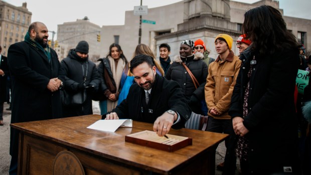 New York City Mayor Zohran Mamdani signs executive orders during a press conference in Brooklyn on Friday, Jan. 2, 2026. (AP Photo/Eduardo Munoz Alvarez)