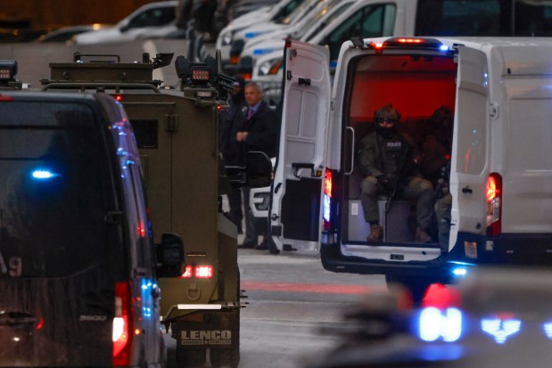 Federal law enforcement personnel ride ahead of an armored vehicle carrying Venezuelan President Nicolas Maduro and his wife Cilia Flores as it arrives at Manhattan Federal Court, Monday, Jan. 5, 2026, in New York. (AP Photo/Stefan Jeremiah)