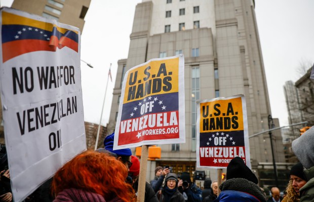 People protest outside Manhattan Federal Court before the arraignment of Venezuelan President Nicolas Maduro, Monday, Jan. 5, 2026, in New York. 