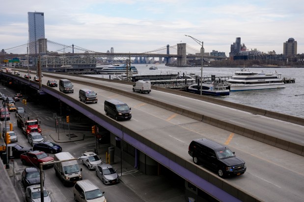 A motorcade makes its way down the FDR Drive after leaving Manhattan Federal Court where Venezuelan President Nicolas Maduro was arraigned with his wife Cilia Flores, Monday, Jan. 5, 2026, in New York. (AP Photo/Seth Wenig)