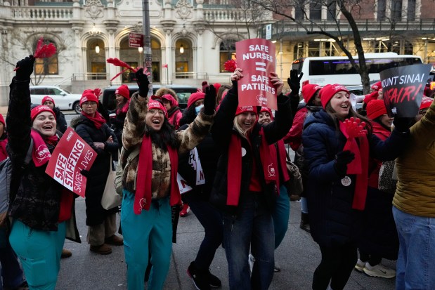 Nurses strike outside Mount Sinai West Hospital, Monday, Jan. 12, 2026, in New York. (AP Photo/Yuki Iwamura)