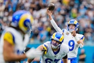 Los Angeles Rams quarterback Matthew Stafford (9) passes the ball during an NFL wild-card...