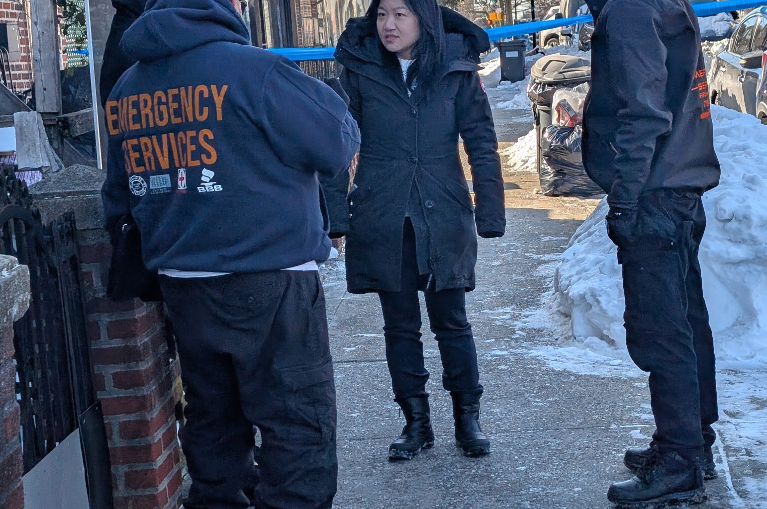 Representatives from Councilmember Zhuang’s office coordinate with first-responders in the aftermath of a fire on 13th Ave. Photo courtesy Councilmember Zhuang’s office