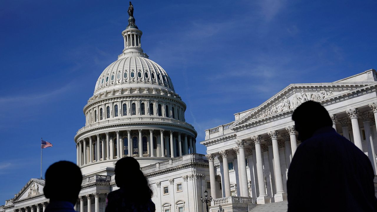 FILE - People walk outside the U.S. Capitol building in Washington on June 9, 2022. Members of the House and Senate were informed Wednesday, March 8, 2023, that hackers may have gained access to their sensitive personal data in a breach of a Washington, D.C., health insurance marketplace. (AP Photo/Patrick Semansky, File)