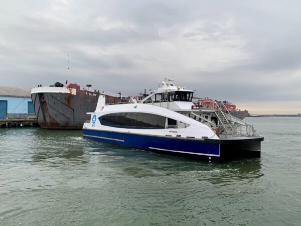 The NYC Ferry “White Sands” departs from Pier 6 in Brooklyn Bridge Park in November 2025. The tanker B. No. 210, identified as belonging to Bouchard Transportation, can be seen docked at Pier 7. Photo: Mary Frost, Brooklyn Eagle