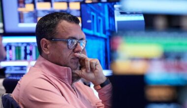 Wall Street edges back from its records as earnings season begins