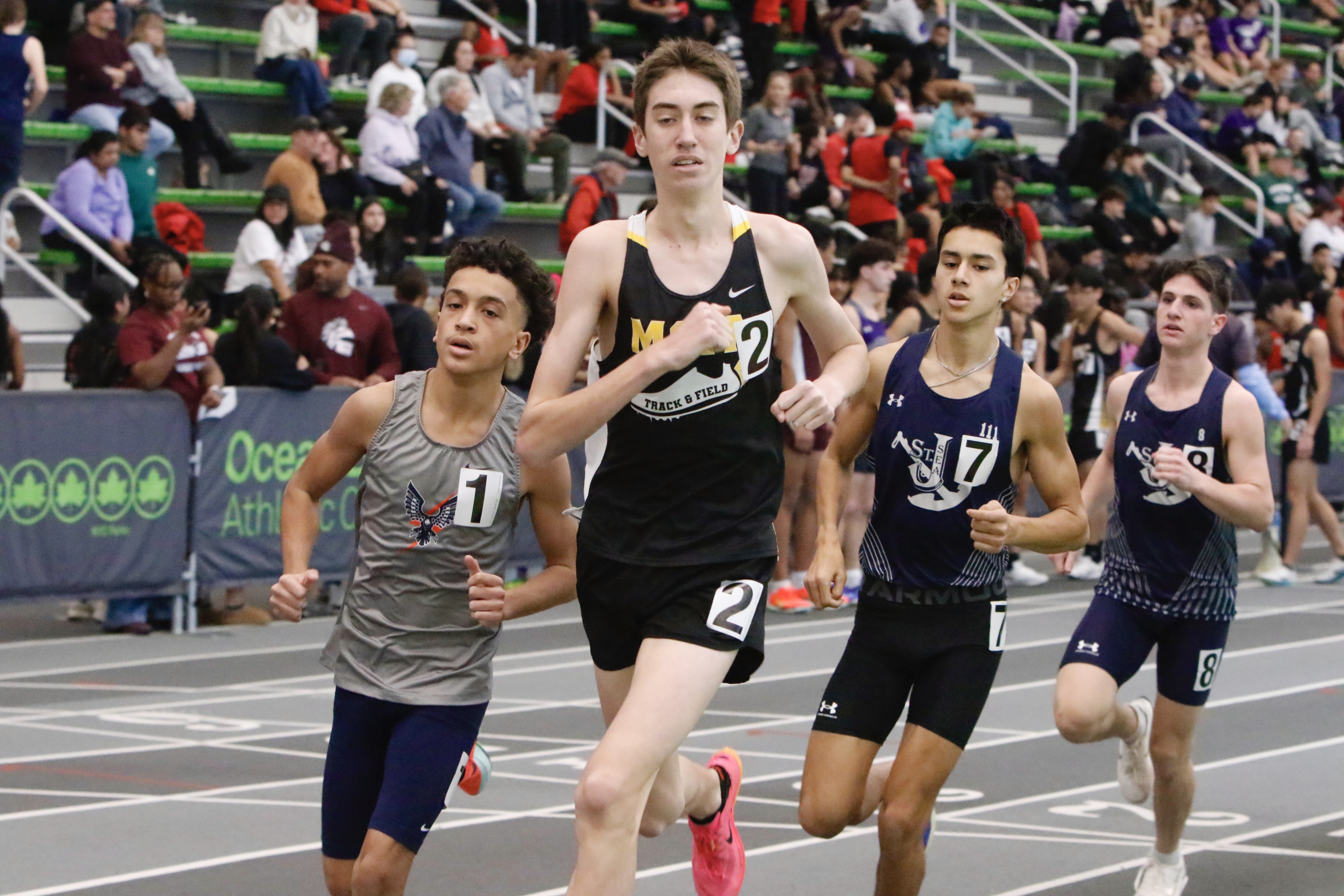 MSIT's Scott Kelly, Susan Wagner's Tristan Acevedo and Sea's Adam Vitale battle it out in the 1600 meters at the Staten Island High School Indoor Track and Field Championship on Jan. 18, 2026.