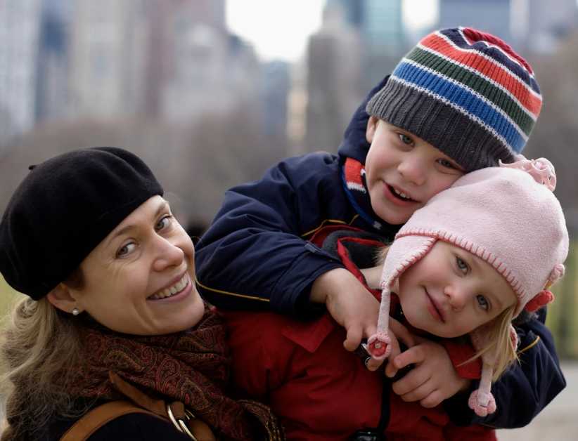 Mother, son, and daughter in Central Park , one of the best Free Things to Do in NYC in the Winter 