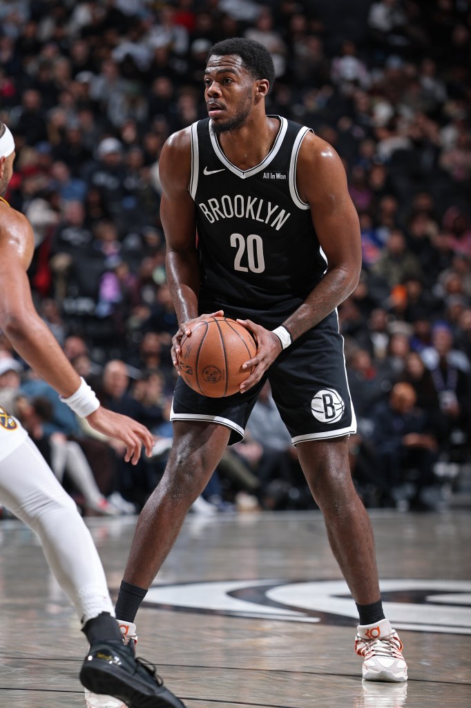 Day'Ron Sharpe #20 of the Brooklyn Nets looks to pass the ball during the game against the Denver Nuggets on January 4, 2026 at Barclays Center in New York City, New York. 