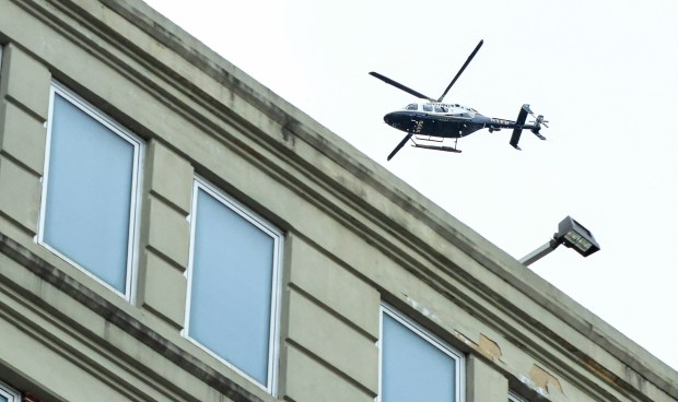 A New York City Police Department (NYPD) helicopter flies above the Metropolitan Detention Center in the Brooklyn borough of New York City, where ousted Venezuelan president Nicolas Maduro is being held on January 5, 2026. Deposed Venezuelan president Nicolas Maduro pleaded not guilty to charges of narco-terrorism in a New York court on Monday, two days after being snatched by US forces in a stunning raid on his home in Caracas. Maduro, 63, told a federal judge in Manhattan that he had been "kidnapped" from Venezuela and said "I'm innocent, I'm not guilty," US media reported. (Photo by Kena Betancur / AFP via Getty Images)