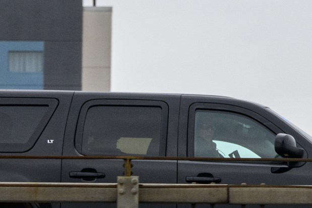NEW YORK, NEW YORK - JANUARY 05: A law enforcement offier looks out of the motorcade believed to be carrying Venezuela's Nicolas Maduro and his wife Cilia Flores, as they drive across the Gowanus before arriving at the MDC detention center on January 05, 2026 in New York City. Maduro and Flores were brought to New York on Saturday after they were captured by the U.S. military in Caracas. They are being detained at the Metropolitan Detention Center in Brooklyn and are expected to face federal charges related to narco-terrorism conspiracy. (Photo by Alexi J. Rosenfeld/Getty Images)