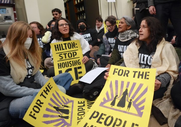 Anti-ICE protesters occupy the Hilton Garden Inn on Sixth Avenue in Tribeca, Manhattan, holding signs that call for the hotel to stop housing federal immigration enforcement agents on Tuesday, Jan. 27, 2026, in New York City, United States. (Photo by Selcuk Acar/Anadolu via Getty Images)