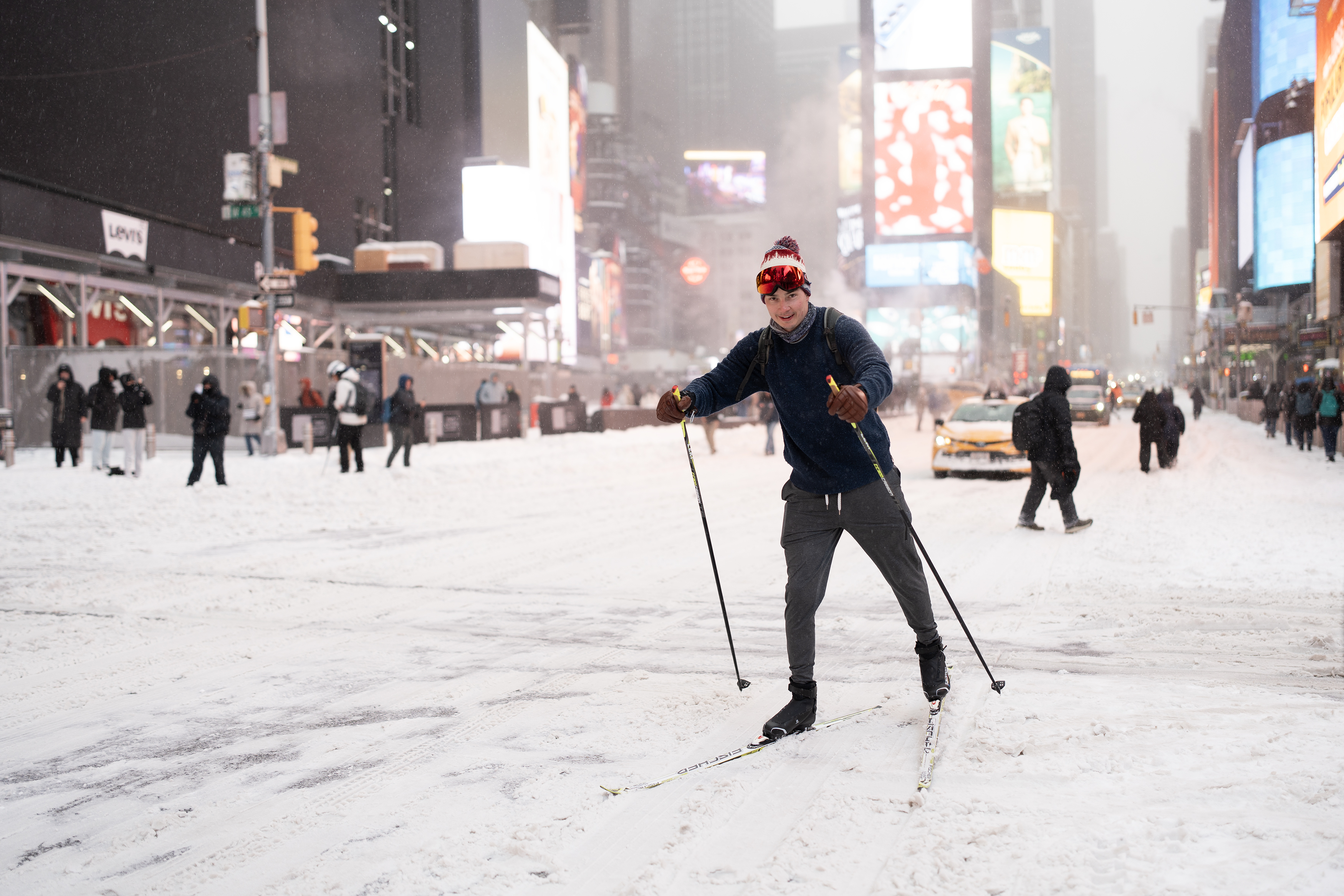 NEW YORK, NY – JANUARY 25: A person skis on double boards at Times Square on January 25, 2026 in New York City. A historic winter storm is sweeping across the Midwest and eastern parts of the United States on January 25, causing unprecedented travel chaos. (Photo by Liao Pan/China News Service/VCG via Getty Images)