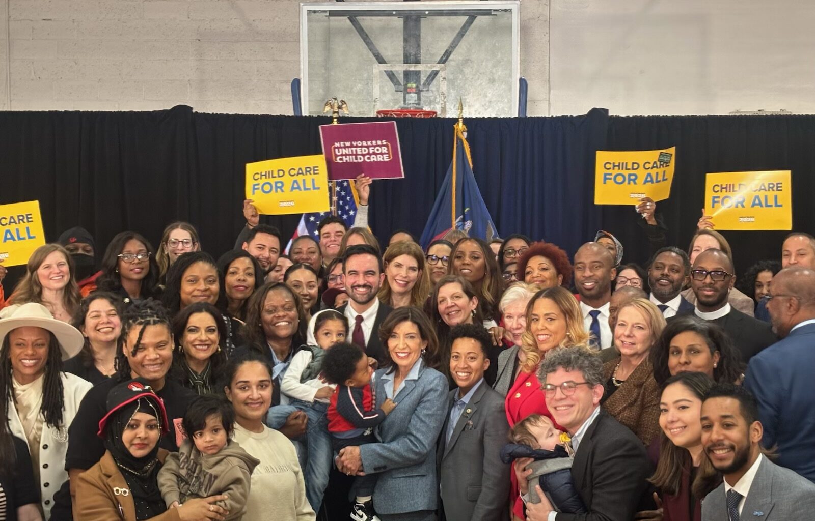 Gov. Kathy Hochul and other elected officials hold children who will benefit from New York’s new universal childcare expansions. Photo: Office of State Senator Kristen Gonzalez