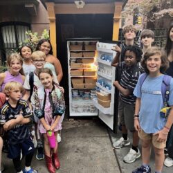 Young volunteers with The Service Collective fill the Brooklyn Heights Community Fridge with meals that they prepare. Photo courtesy of Andrea Kapner, who leads TSC’s ‘Fill the Fridge’ program.