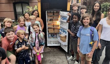 Young volunteers with The Service Collective fill the Brooklyn Heights Community Fridge with meals that they prepare. Photo courtesy of Andrea Kapner, who leads TSC’s ‘Fill the Fridge’ program.