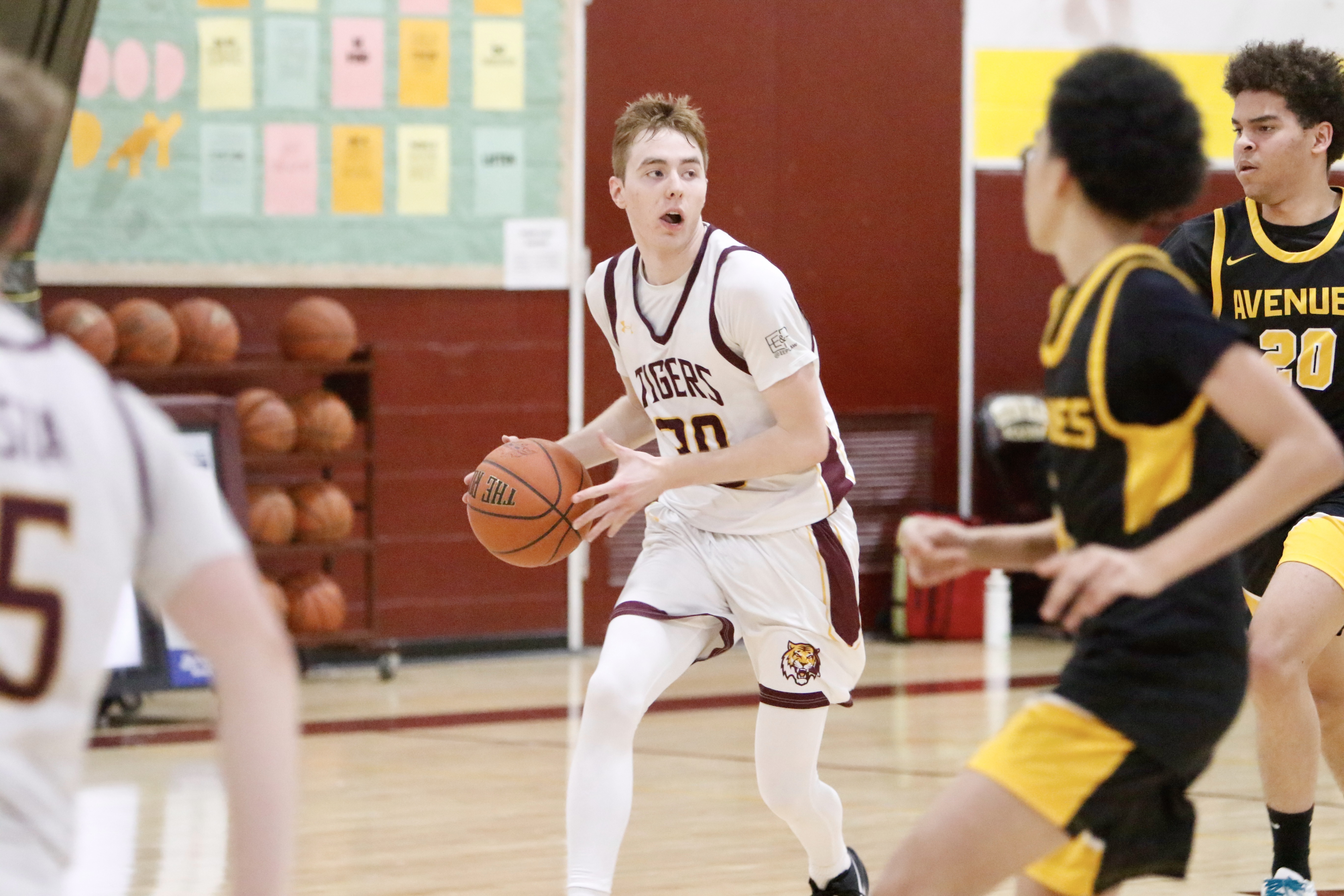 Staten Island Academy's Luke DeVito looks to pass the ball during a matchup against Avenues on Jan. 14, 2025.