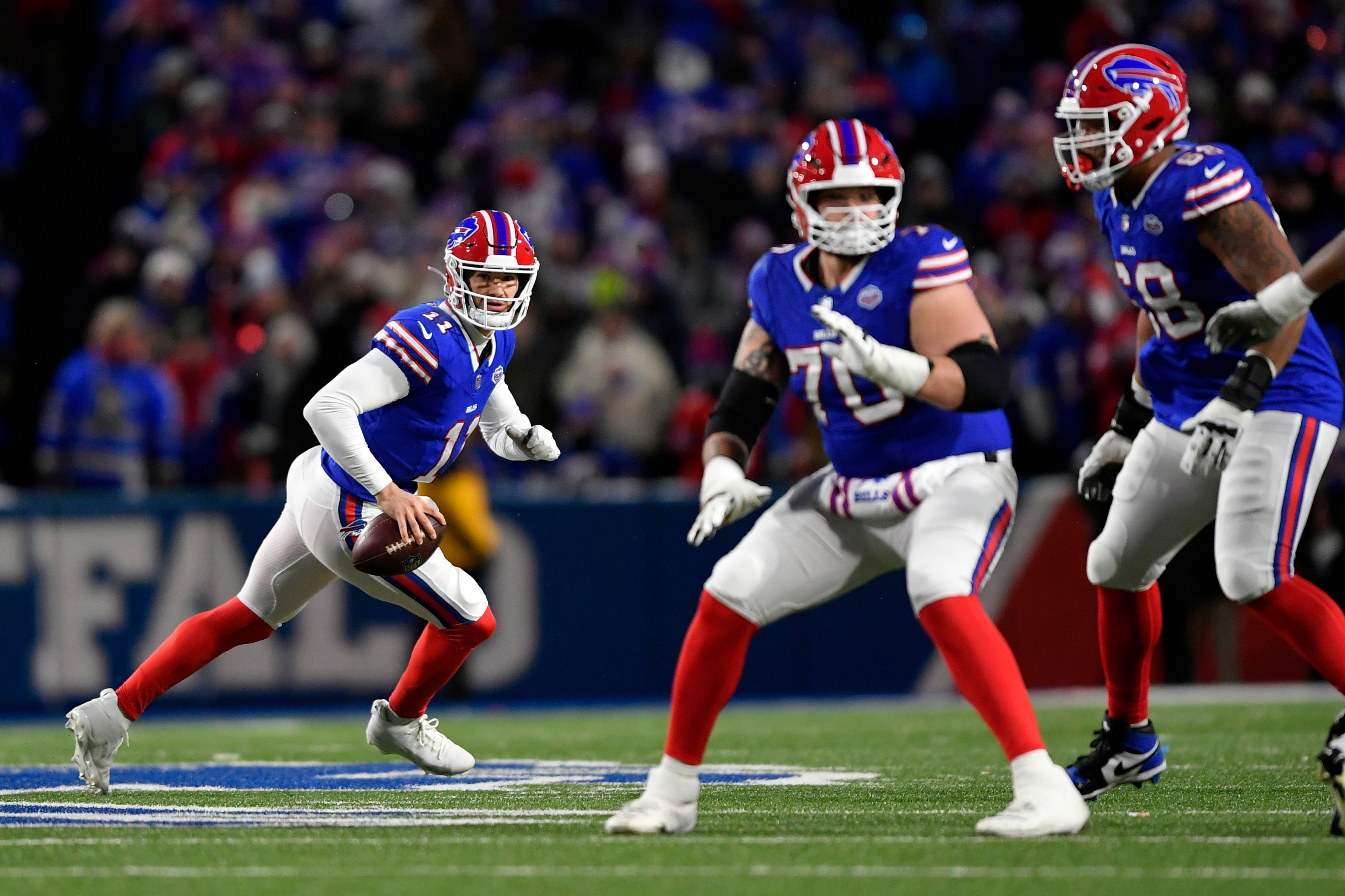 Buffalo Bills quarterback Mitchell Trubisky (11) scrambles against the New York Jets in the first half of an NFL football game Sunday, Jan. 4, 2026, in Orchard Park, N.Y. (AP Photo/Adrian Kraus)