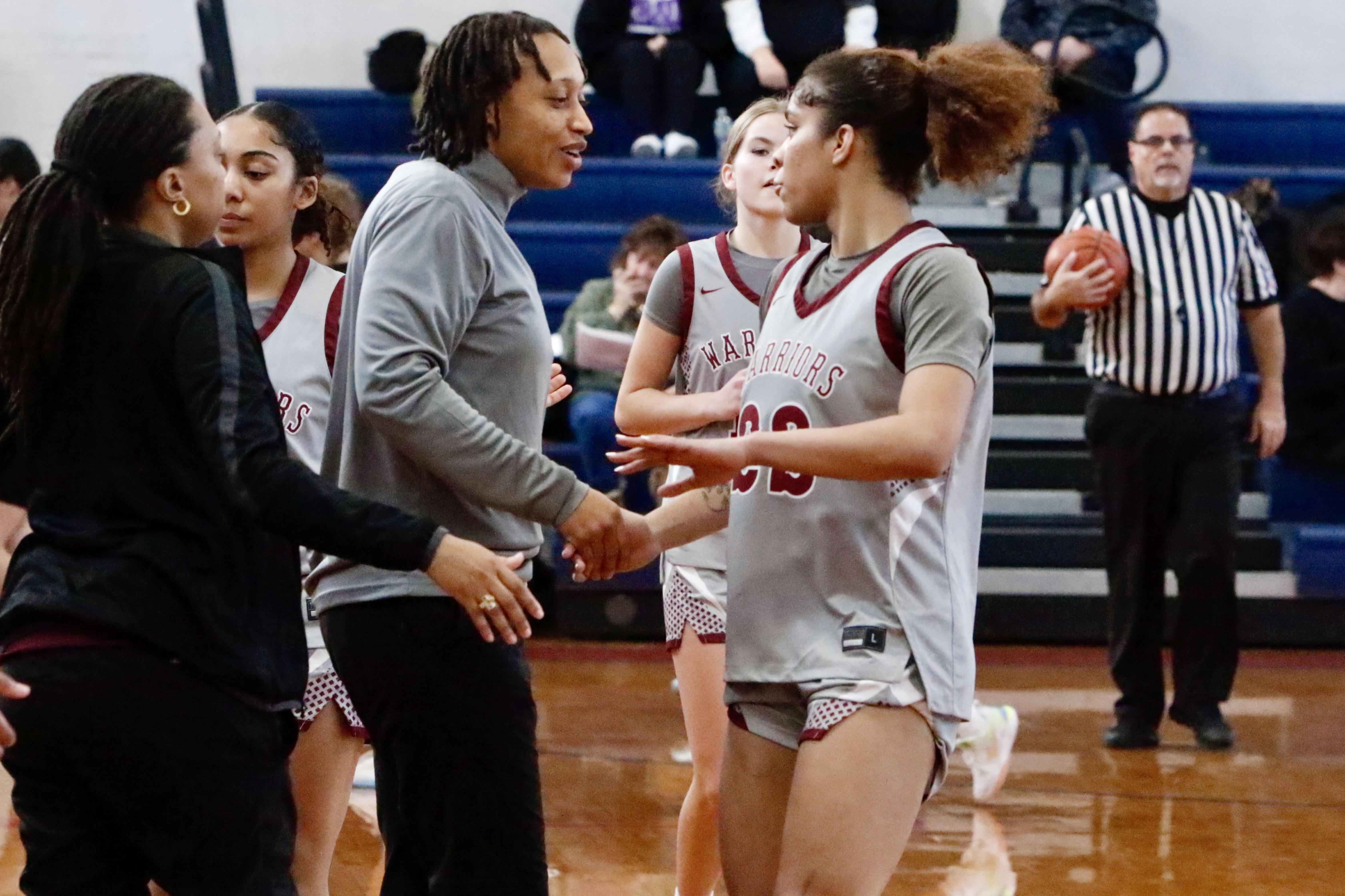 Curtis head coach and senior Janiya Thomas slap hands during a Borough President's Cup matchup vs. MSIT on Jan. 24, 2026.