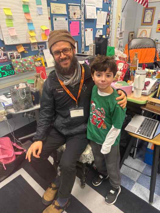 Matthew Reid and a fourth-grade student from Karen Phannemiller and Laura Zilinek’s class, who not only earned money to donate but also donated money from his own piggy bank.