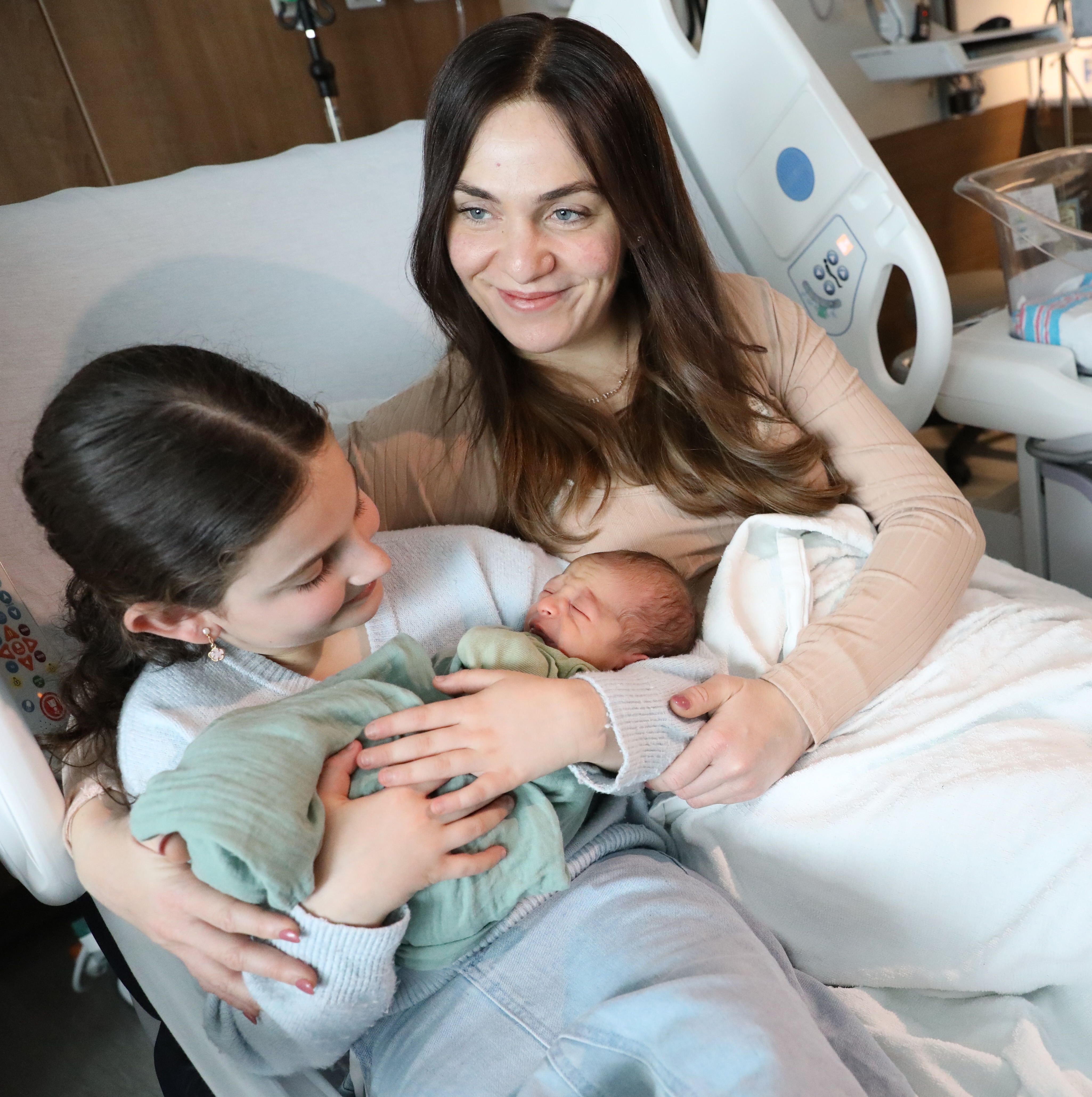 Baby boy Green’s sister Zohar Liberow, 9 and mom, Chaya are so happy at the start of this new year.  (Advance/SILive.com | Jan Somma-Hammel)
