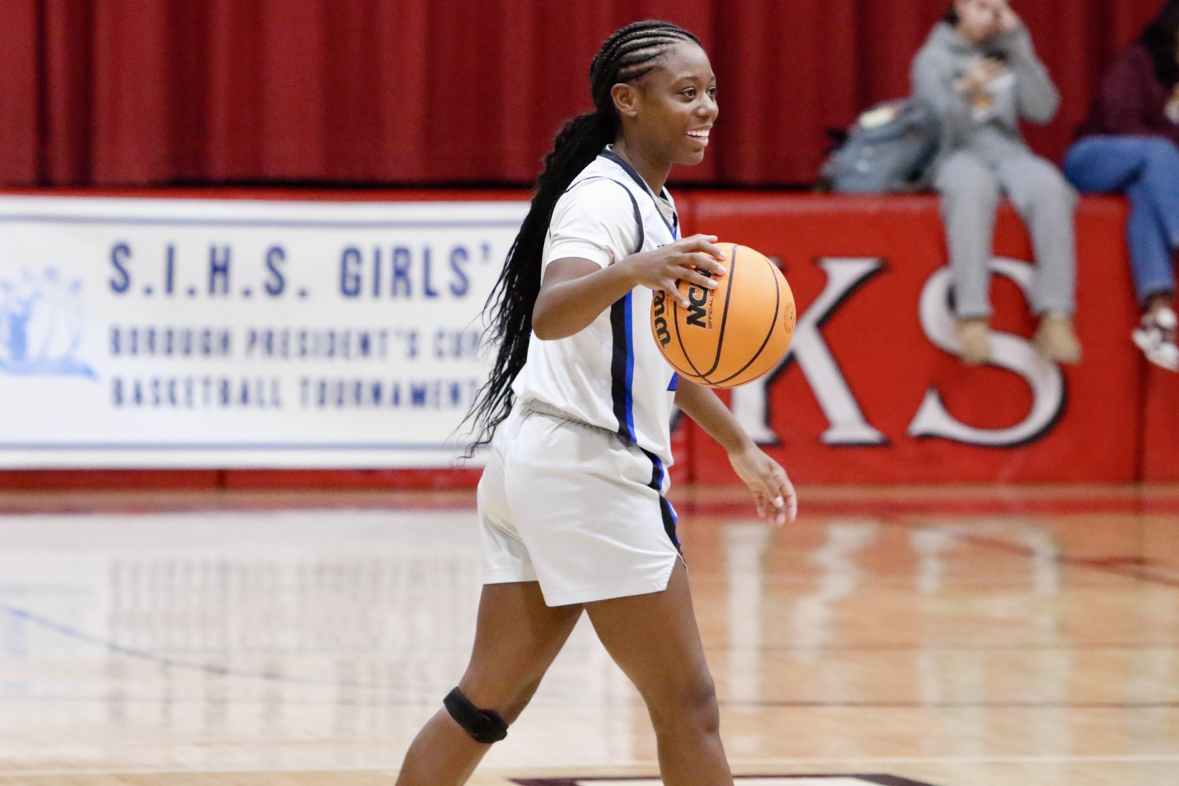 Petrides' Asha Ball is all smiles while handling the ball during a Borough President's Cup game against CSI/McCown on Jan. 23, 2025.