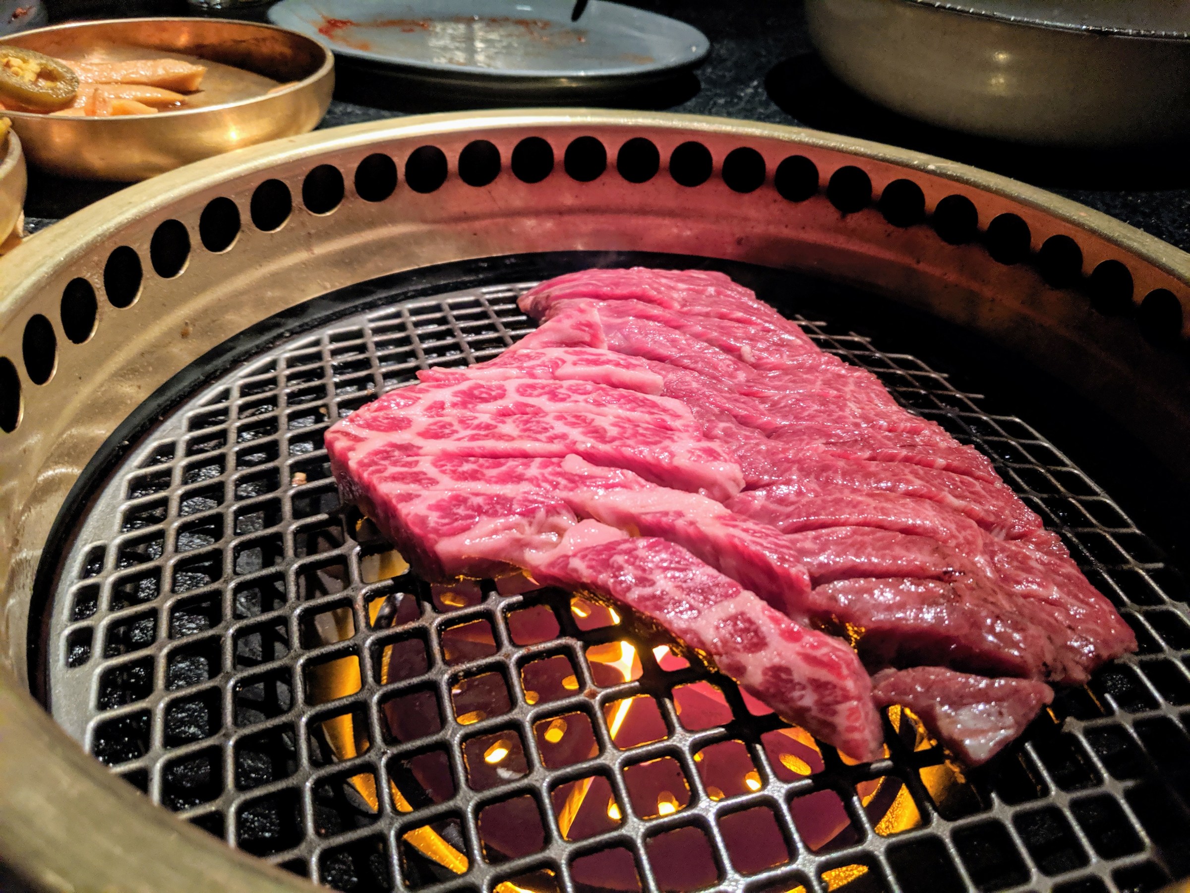 Steak on a tabletop grill.