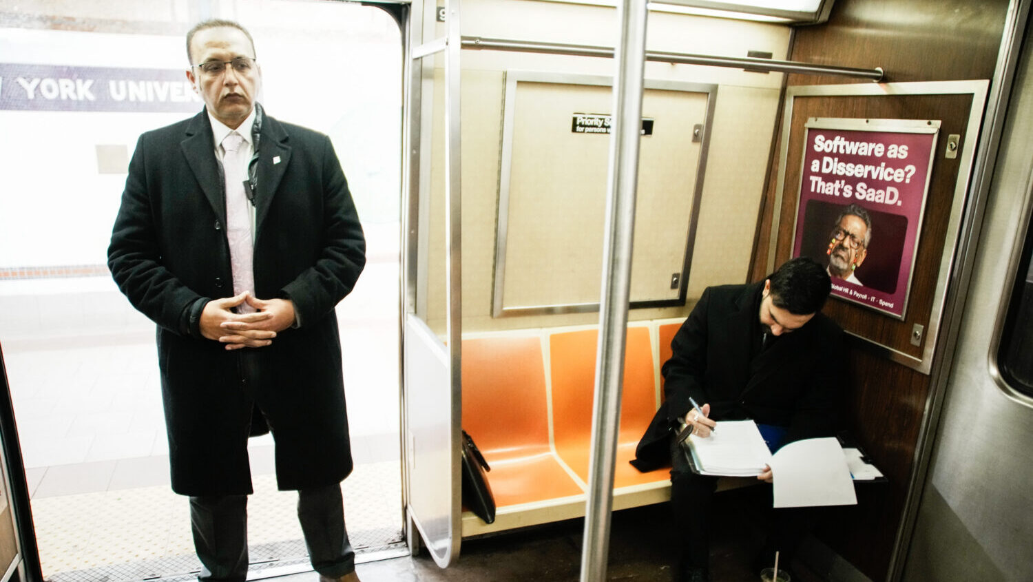 New York City Mayor Zohran Mamdani checks his agenda on the subway on his way to City Hall in New Y...