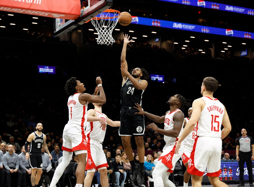 Cam Thomas #24 of the Brooklyn Nets puts up a shot over Amen Thompson #1 of the Houston Rockets in the second half at the Barclays Center in Brooklyn, New York, Thursday, January 1, 2026. 