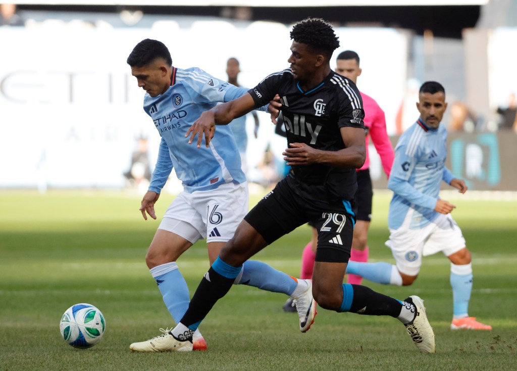 New York City forward Alonso Martínez and Charlotte FC defender Adilson Malanda fight for control of the ball in the first half of the Audi 2025 MLS Cup Playoffs Round One, Game Two at Yankee Stadium in The Bronx, New York, November 01, 2025. 