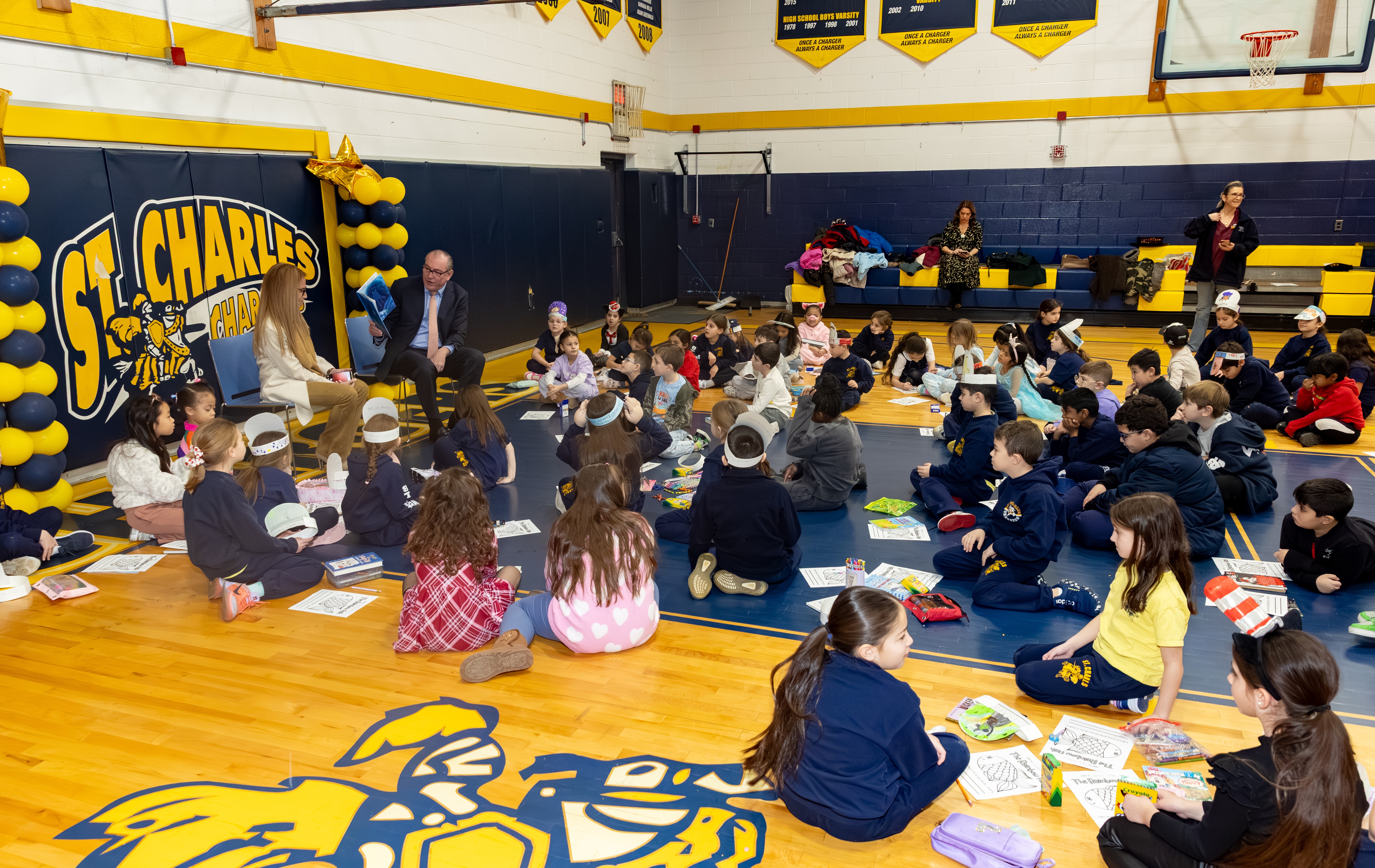Borough President Vito Fossella and Jann Amato, regional superintendent of the Catholic School Region of Staten Island, celebrate literacy day with first and second graders as part of Catholic Schools Week at the St. Charles School in Oakwood on Wednesday, Jan. 28, 2026 (Advance/SILive.com | Jason Paderon)