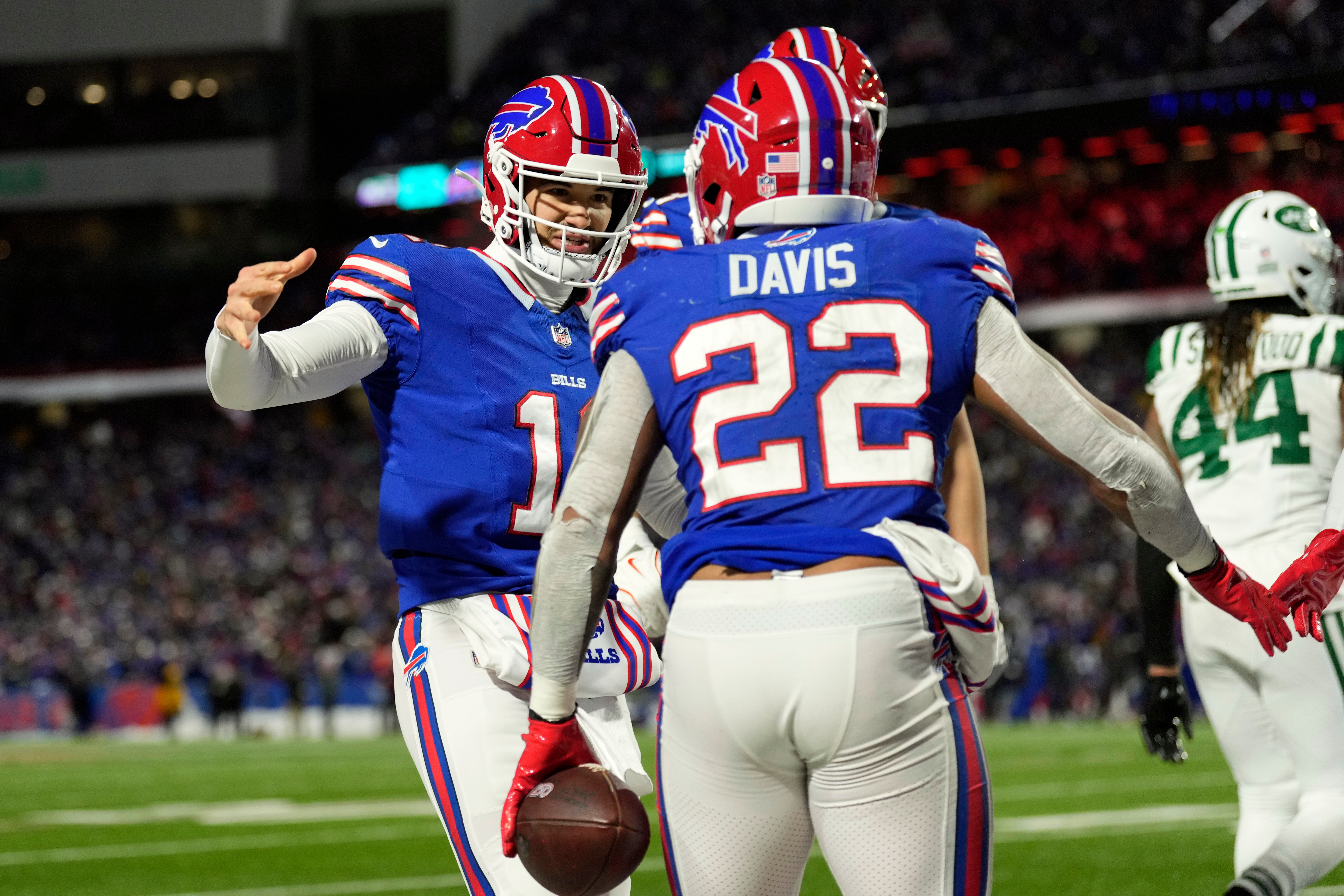 Buffalo Bills quarterback Mitchell Trubisky (11) celebrates with running back Ray Davis (22) after Davis caught a touchdown pass from Trubisky in the first half of an NFL football game against the New York Jets Sunday, Jan. 4, 2026, in Orchard Park, N.Y. (AP Photo/Seth Wenig)