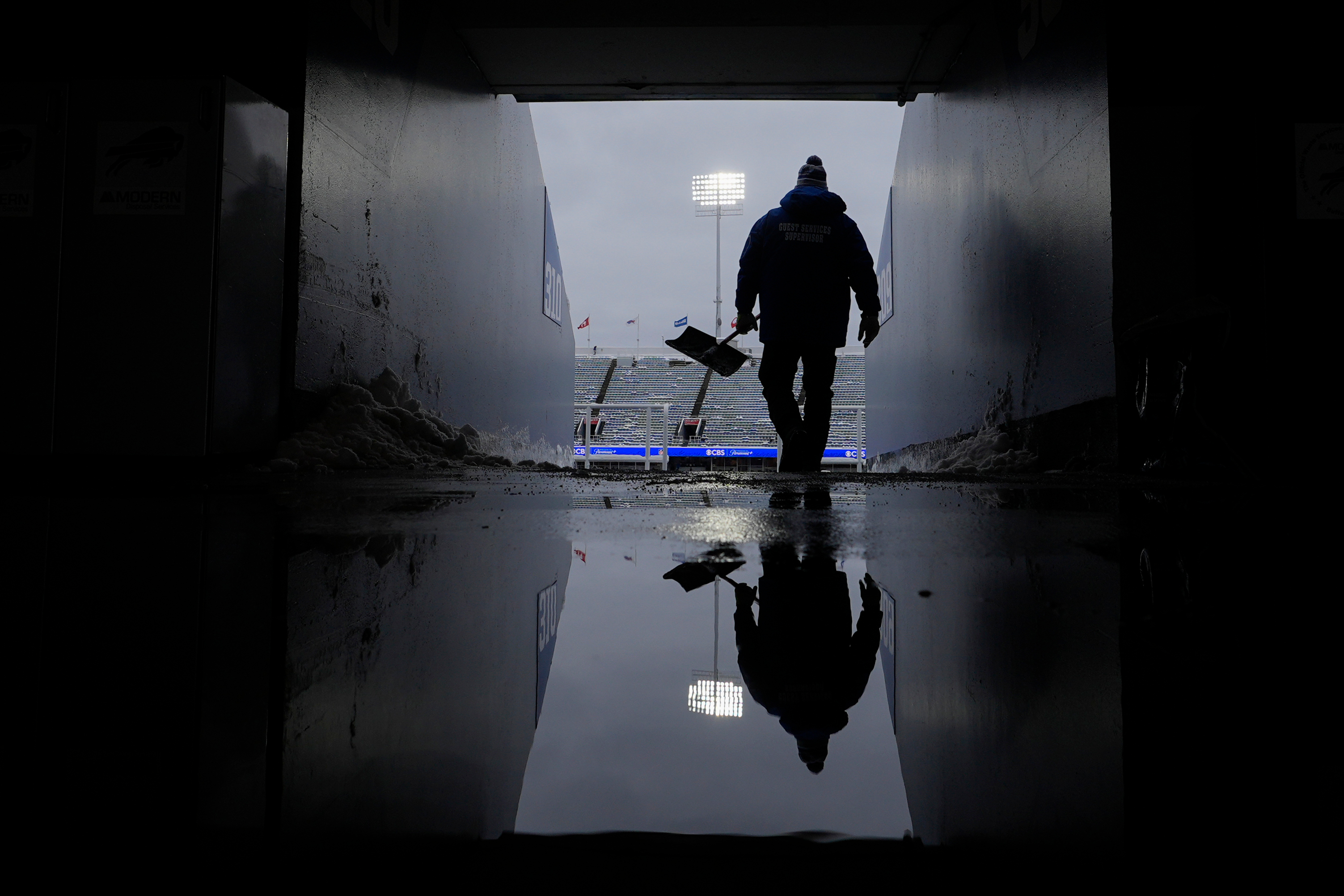 Michael Wygant shoves snow from a tunnel before an NFL football game between the Buffalo Bills and the New York Jets at Highmark Stadium, Sunday, Jan. 4, 2026, in Orchard Park, N.Y. (AP Photo/Carolyn Kaster)