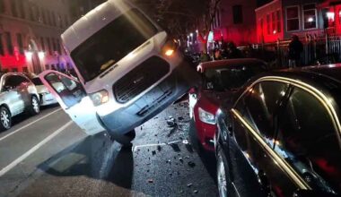 Norwood: No Injuries Reported as Truck Lands on Car After Hull Ave. Crash