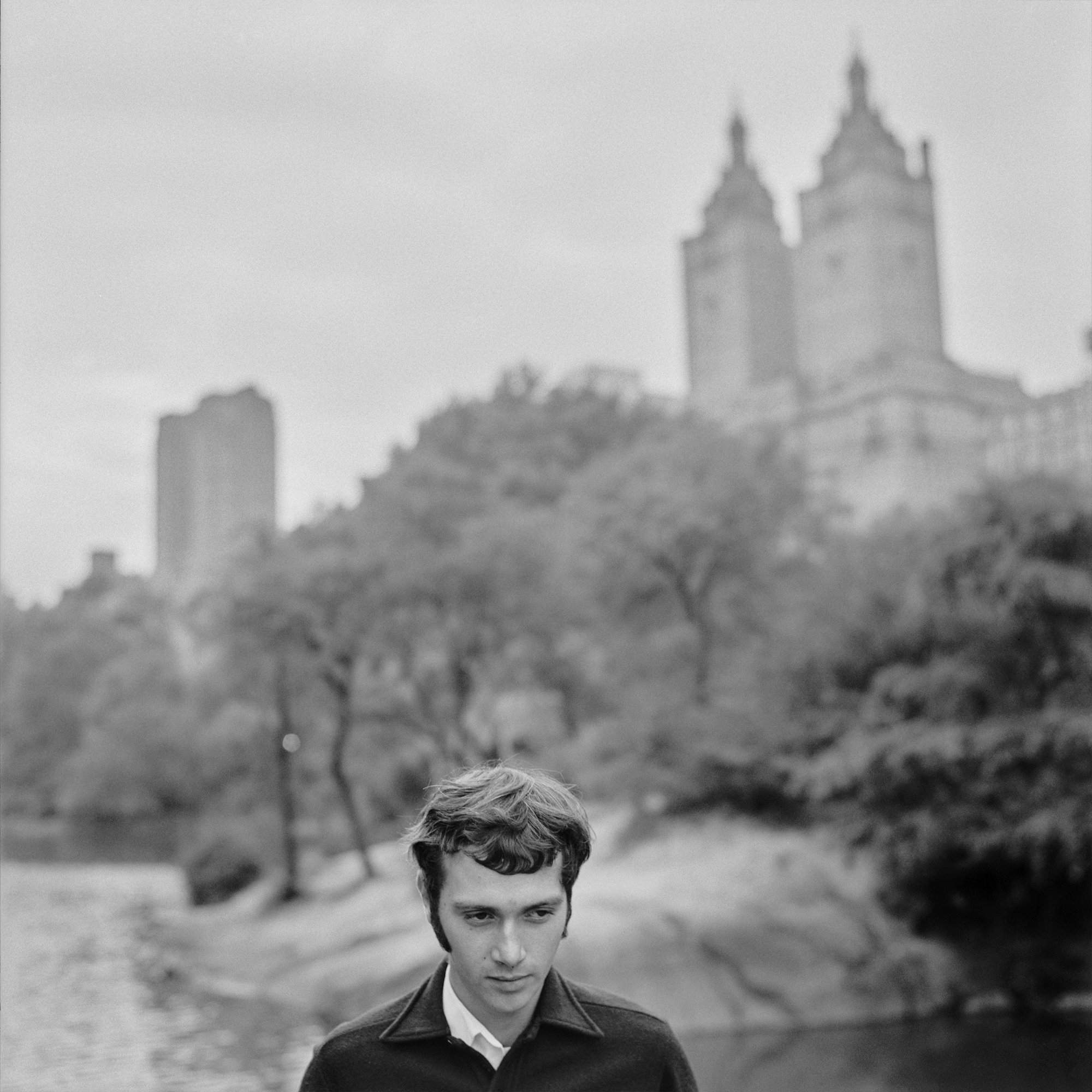 black and white photograph of man in park