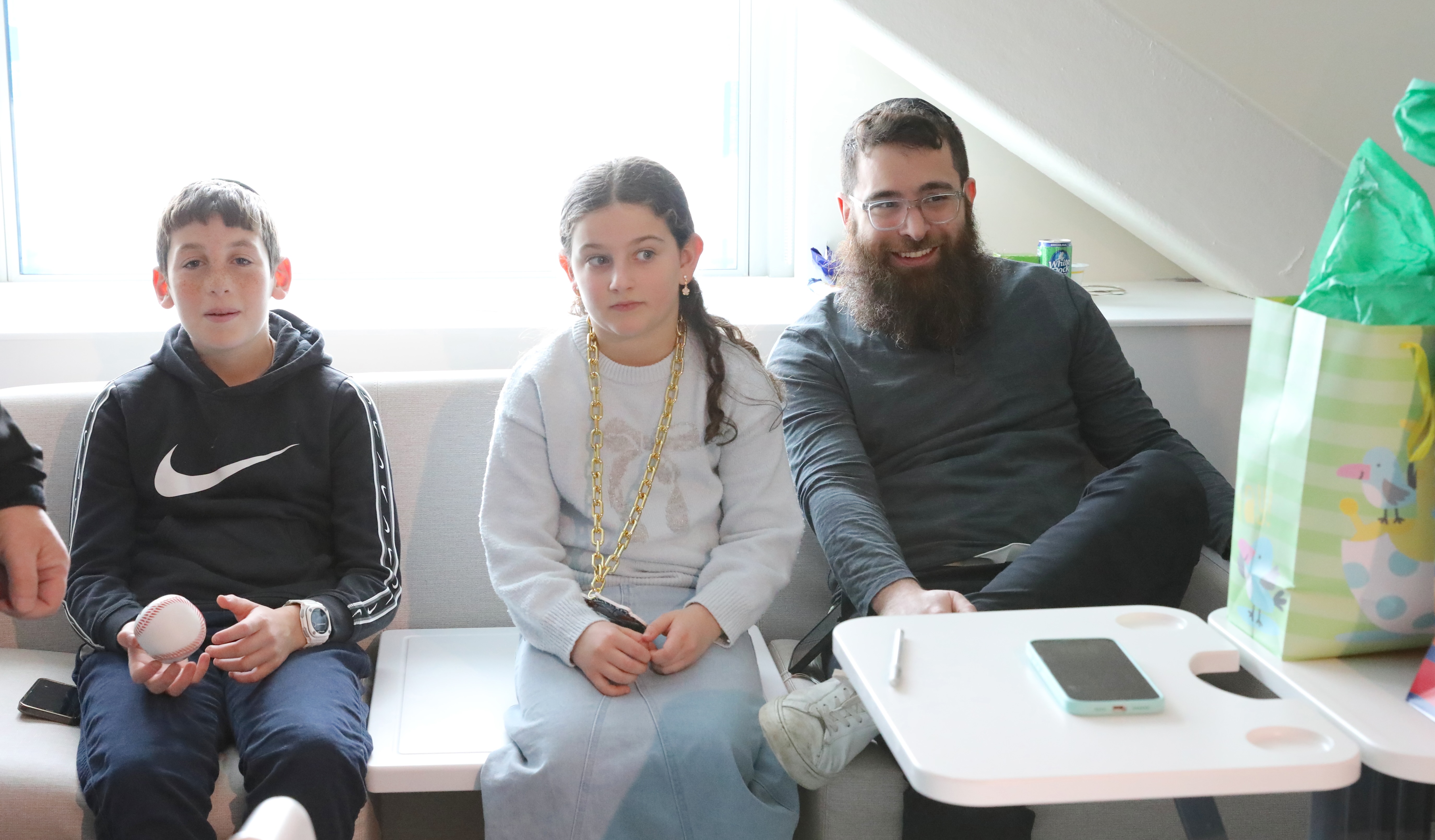 Uncle Yossi Althaus, 12 came from Australia, baby’s sister Zohar Liberow, 9 and dad, Justin Green are on hand as Baby Boy Green becomes the Staten Island Ferry Hawks family of the year. (Advance/SILive.com | Jan Somma-Hammel)
