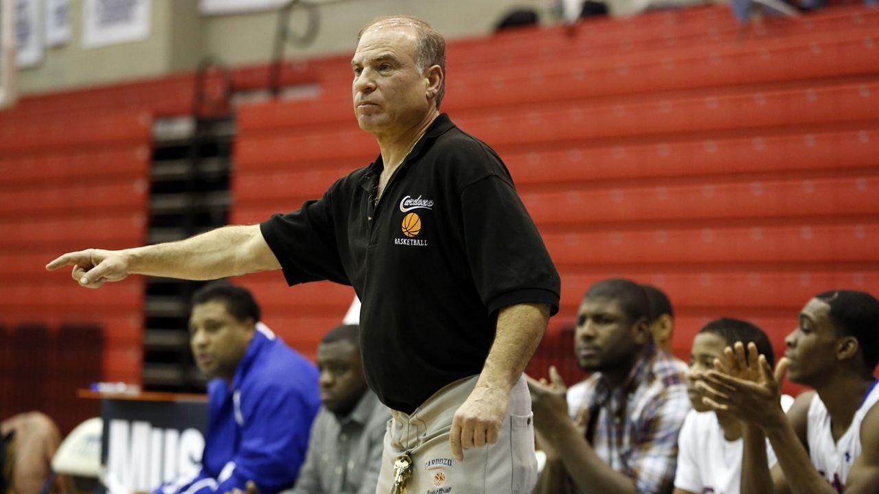 Benjamin Cardozo head coach Ron Naclerio works the sidelines against Iona Prep during a high school basketball game at Baruch College in New York, Saturday, Jan. 18, 2014. Cardozo won the game. (AP Photo/Gregory Payan)