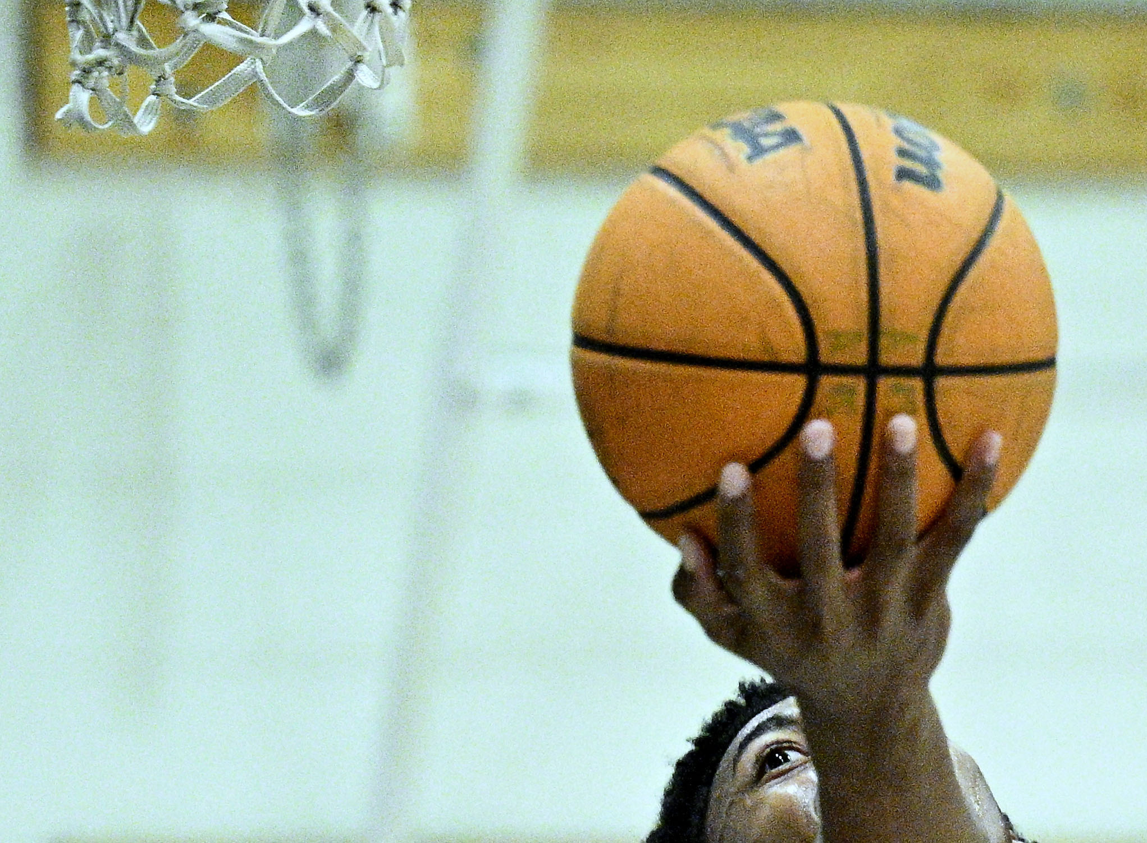Aquinas forward Brooklyn Ross (2) goes up for a layup...