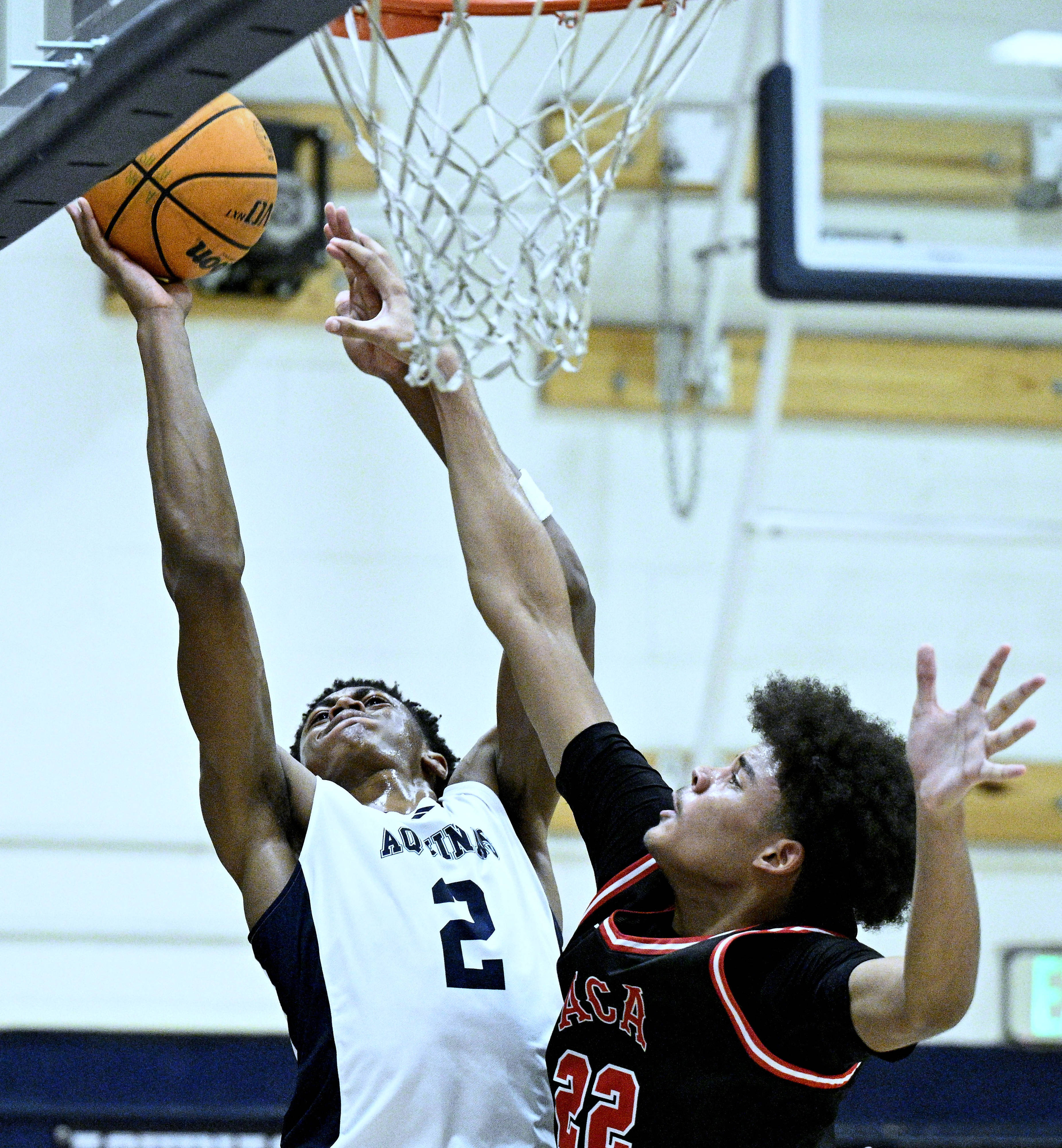 Aquinas forward Brooklyn Ross (2) shoots over Arrowhead Christian Academy...