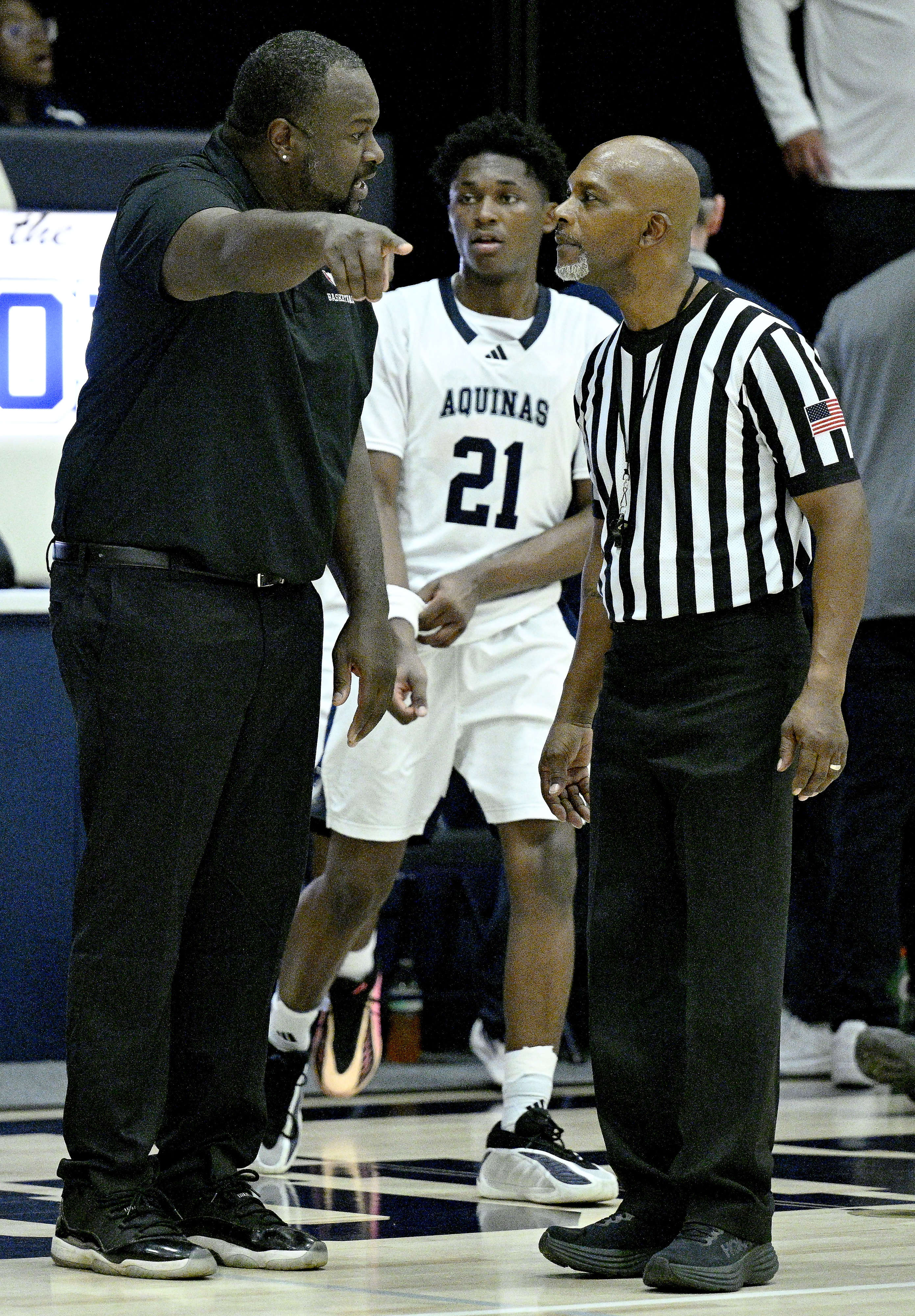Arrowhead Christian Academy Head Coach Lance Evbuomwan argues a call...