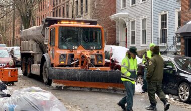 This salt-spreader truck equipped with a snow plow ran into an Amazon cargo bike in Brooklyn Heights on Wednesday, sending the Amazon worker to the hospital. Photo: Mary Frost, Brooklyn Eagle
