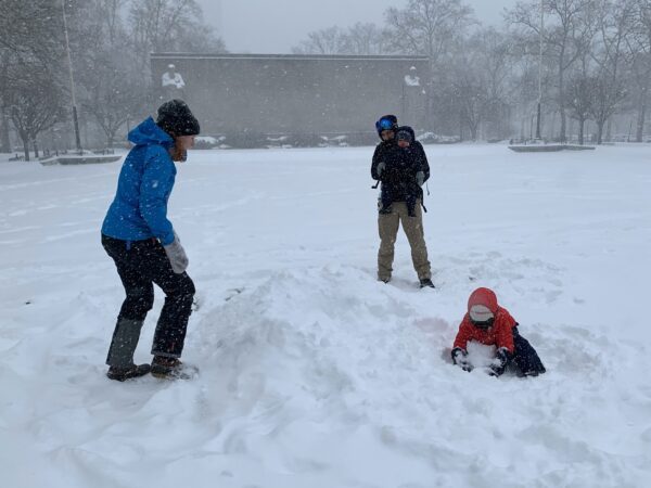 This family was one of the few that tried to build a snowman in Cadman Plaza Park during Sunday’s big storm. Photo: Mary Frost, Brooklyn Eagle
